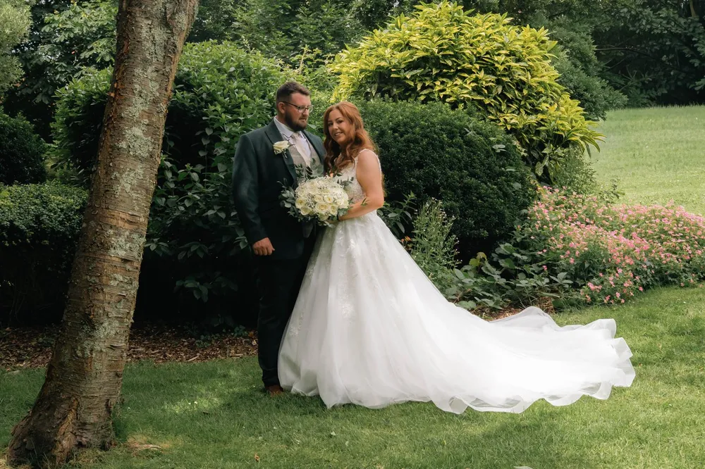 A bride and groom in the garden at The Lord Nelson Hotel
