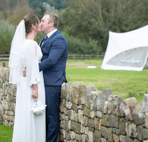 A couple on their wedding day at a partner venue