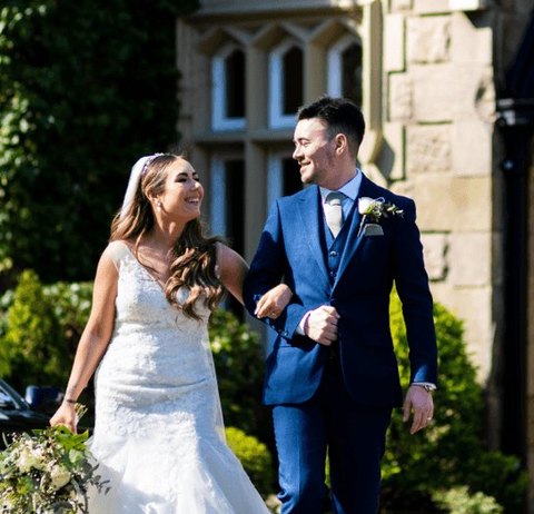 Newlyweds outside their wedding venue