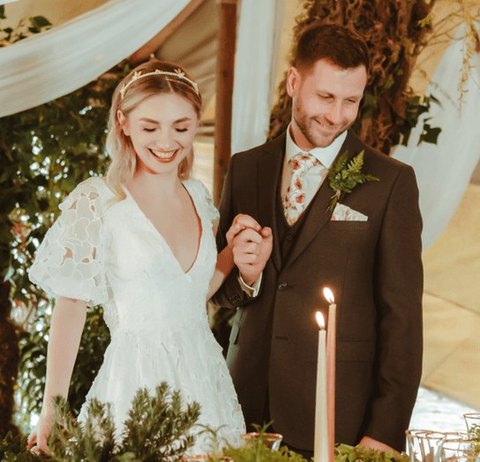A bride and groom celebrating together