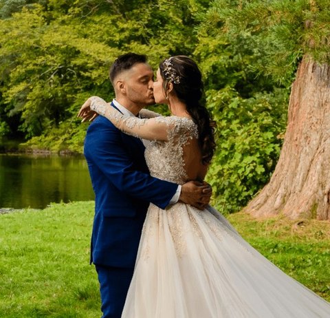 A couple embracing on their wedding day